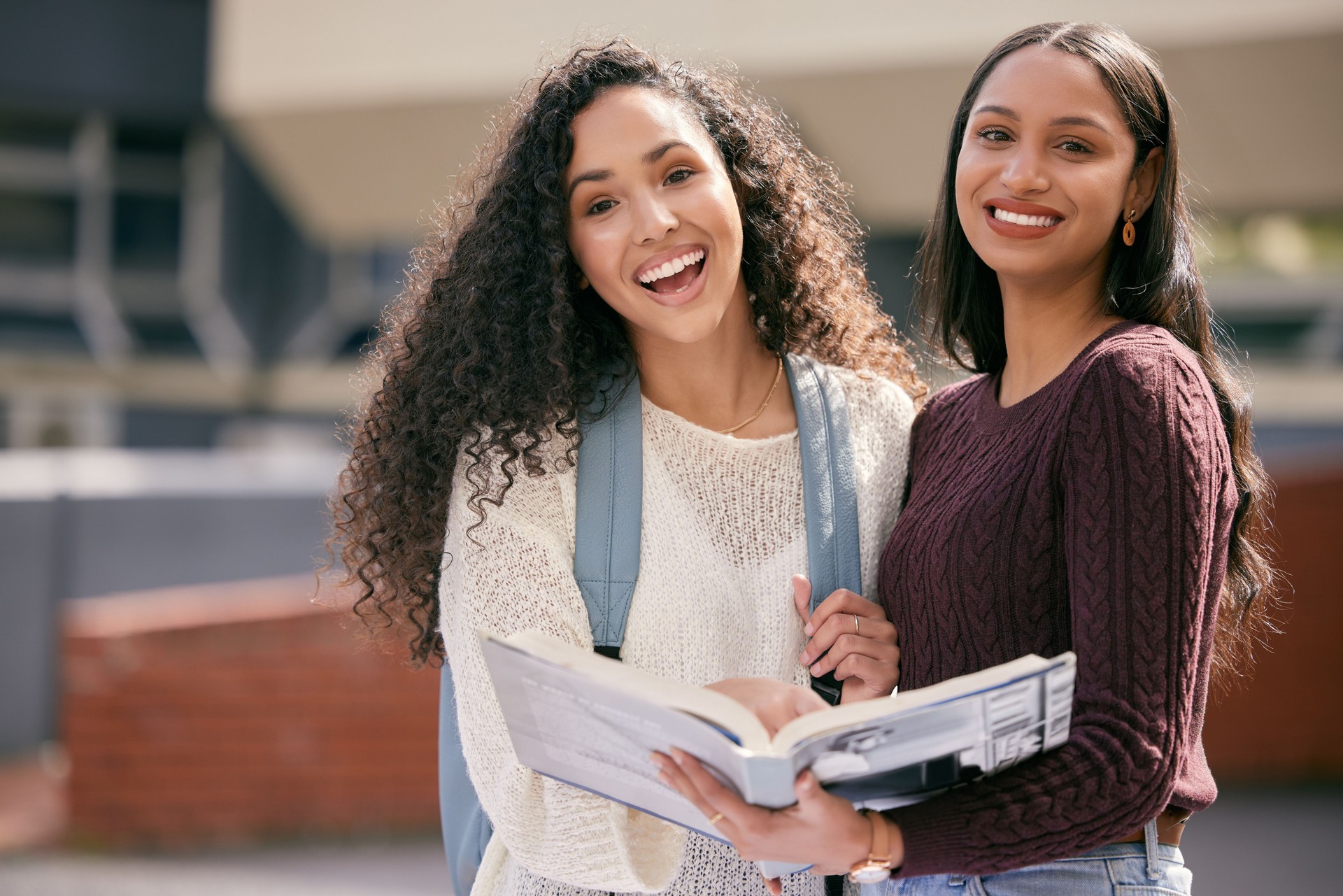 Shot of two young women studying together at college