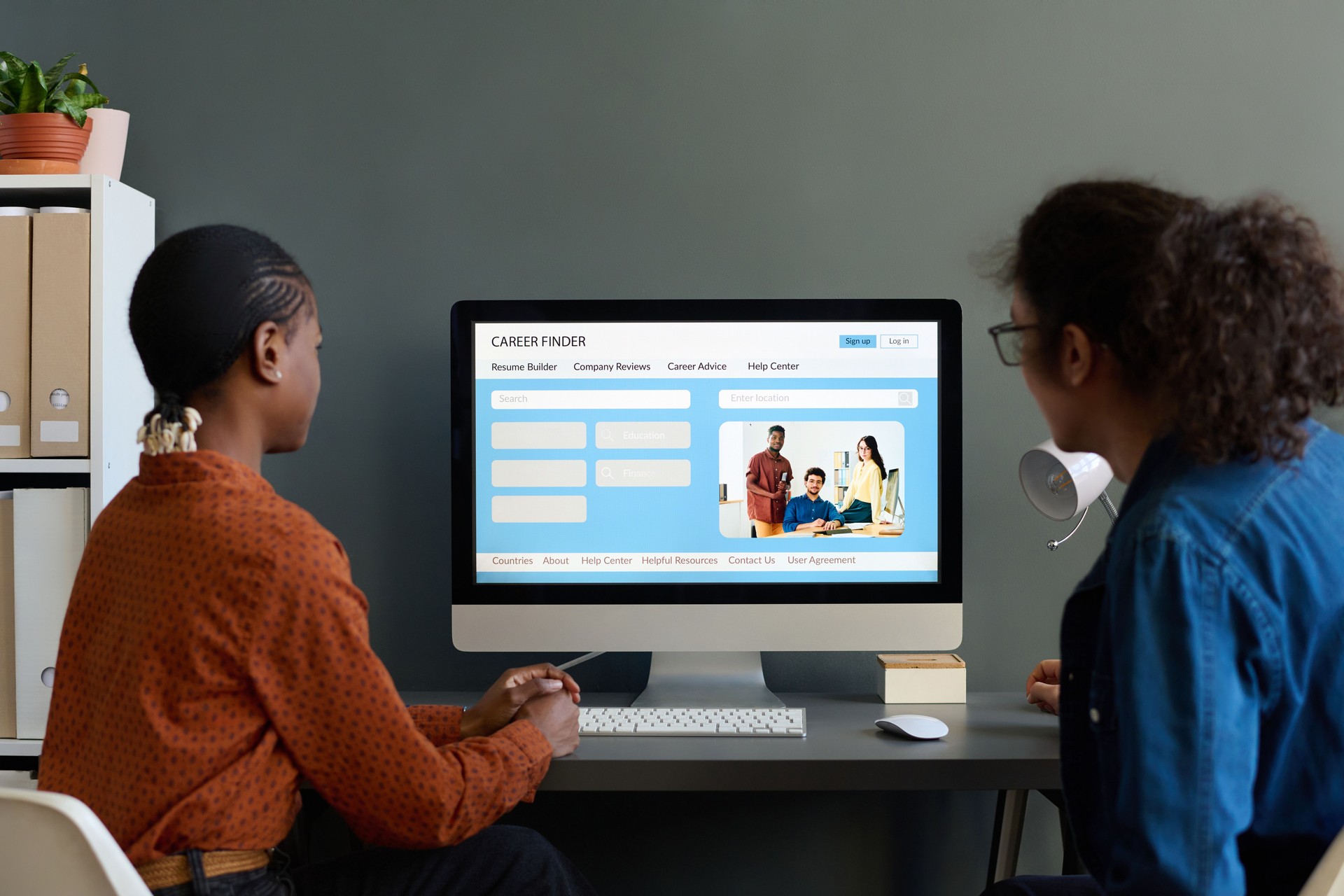 Back View of Two People Using Pc